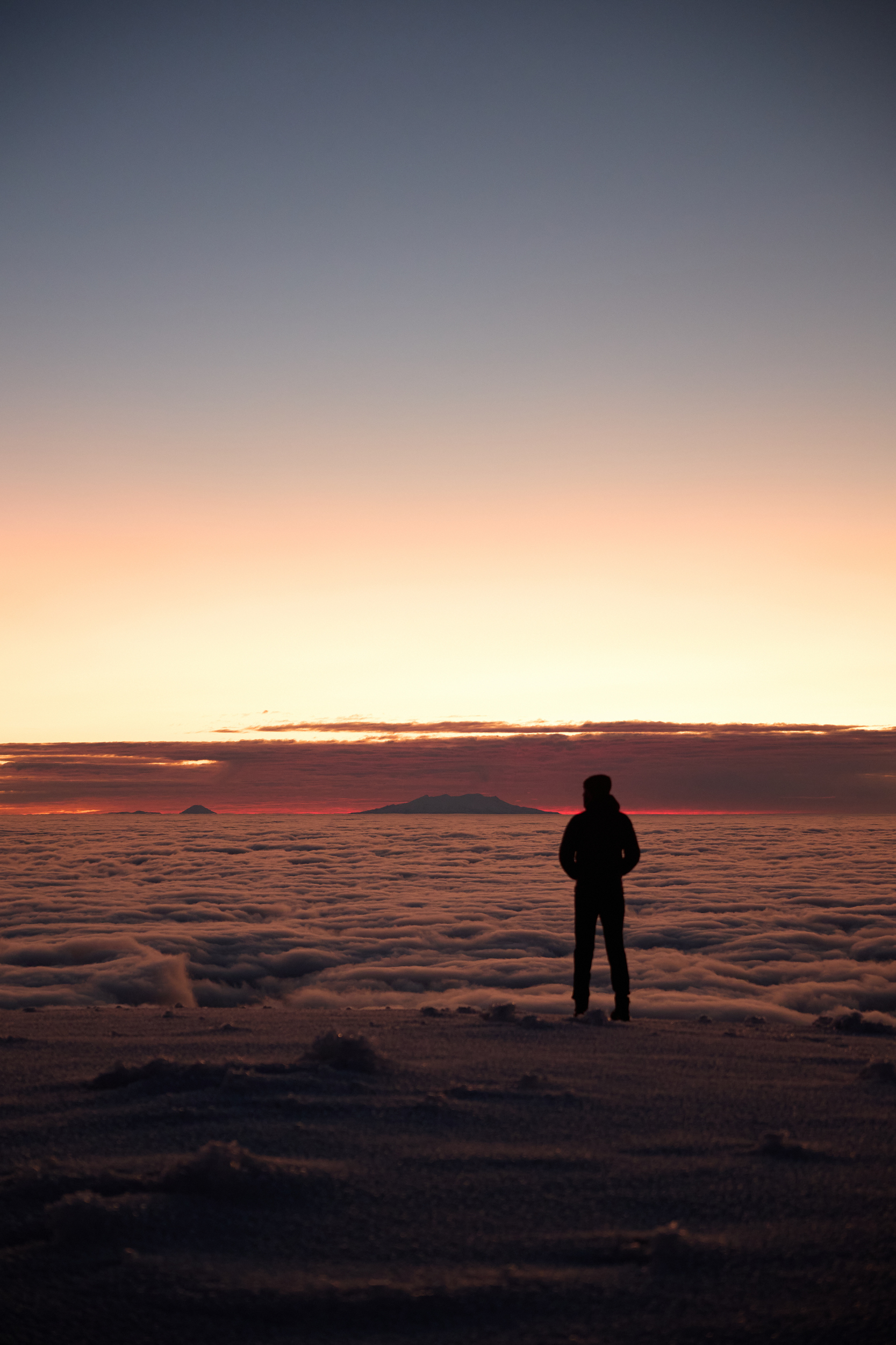 Sunrise cloud inversion with Ngāuruhoe and Ruapehu visible on the horizon